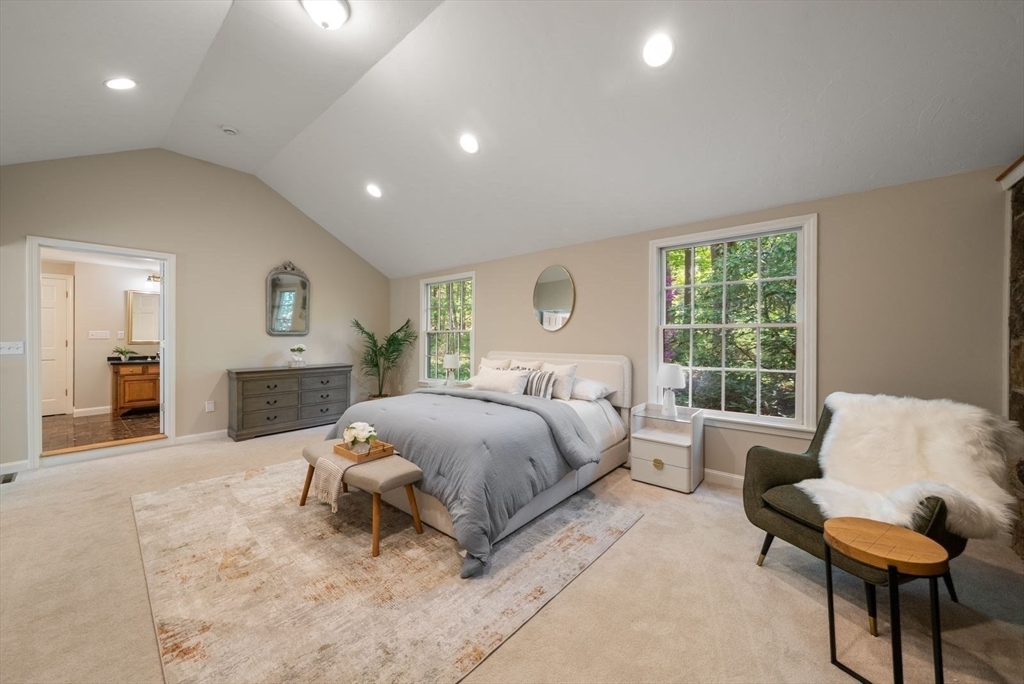 49 Walpole Street Dover, MA 02030 - Photo 18 of 40 a spacious bedroom with a bed and window