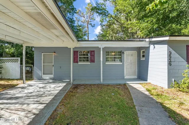 a house view with a backyard space