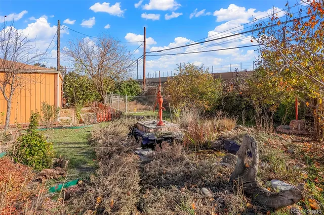 a view of a backyard of the house
