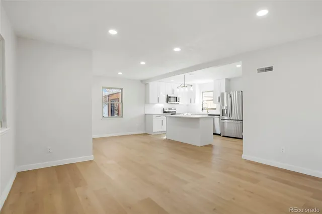 a view of kitchen with wooden floor