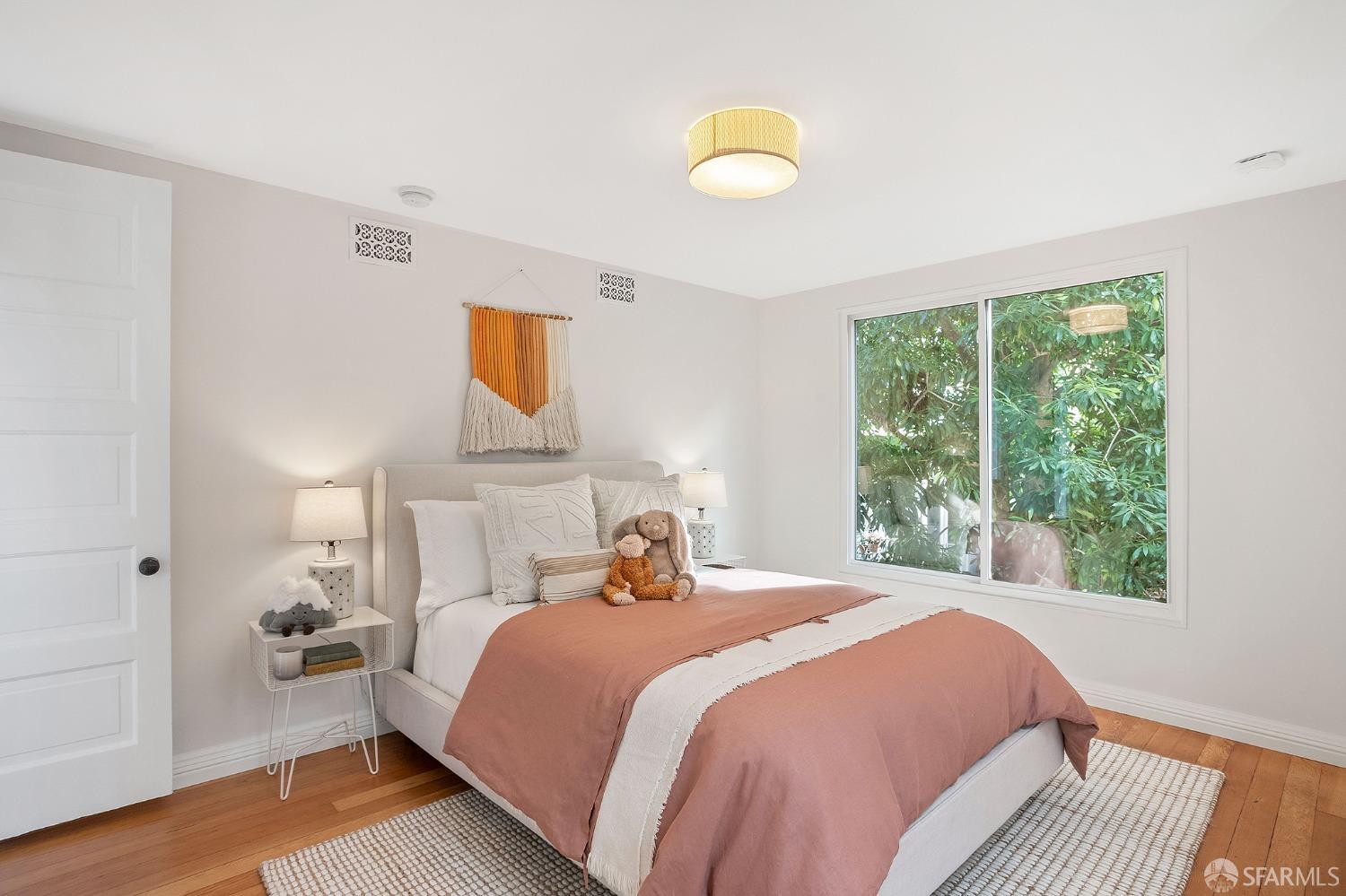 1772 Sanchez Street San Francisco, CA 94131 - Photo 17 of 23 a bedroom with a bed and a window