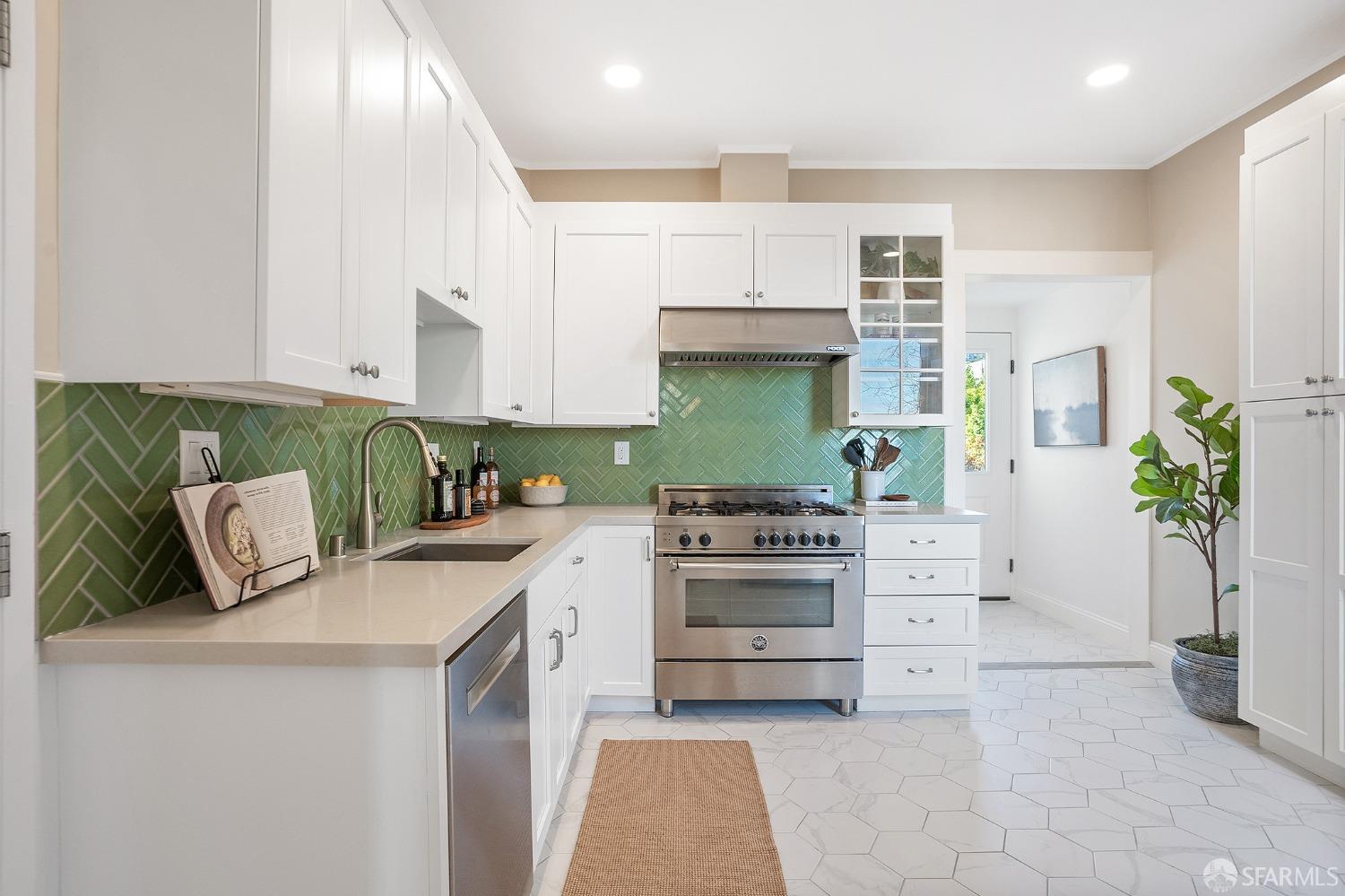 1772 Sanchez Street San Francisco, CA 94131 - Photo 9 of 23 a kitchen with stainless steel appliances a stove a sink and a refrigerator