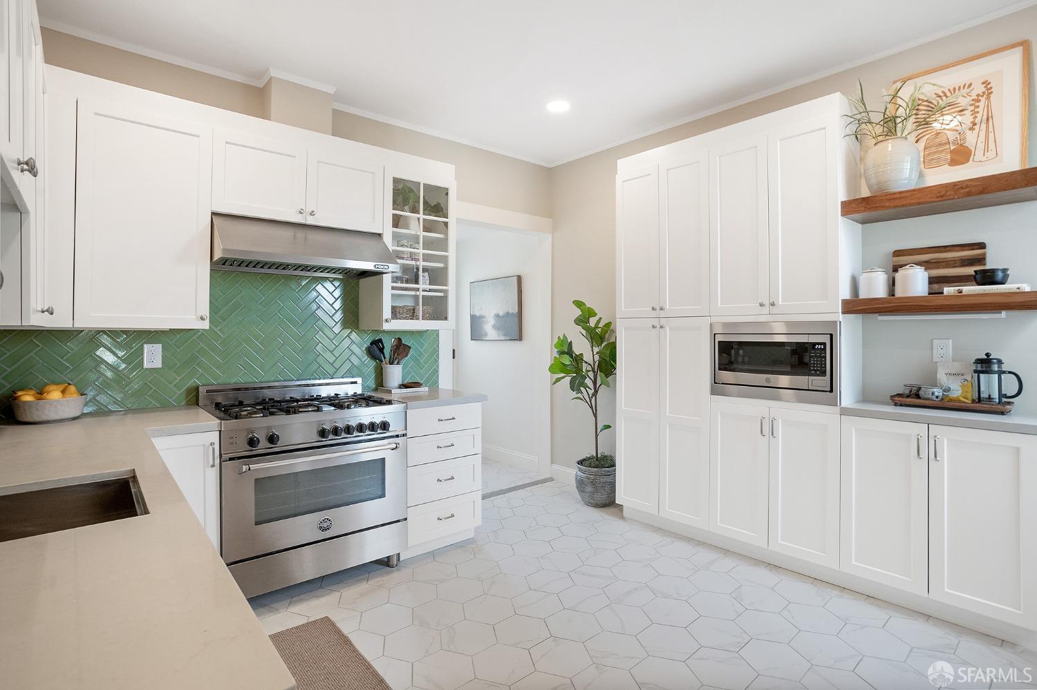 1772 Sanchez Street San Francisco, CA 94131 - Photo 10 of 23 a kitchen with white cabinets and appliances