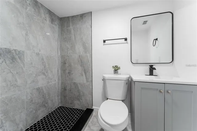 a bathroom with a toilet and a sink