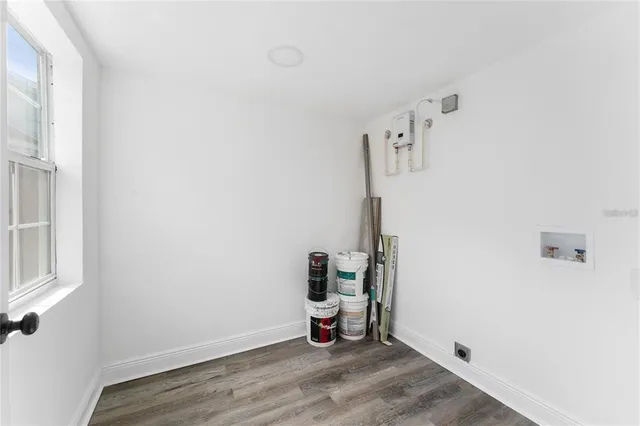 a view of a storage & utility room with wooden floor