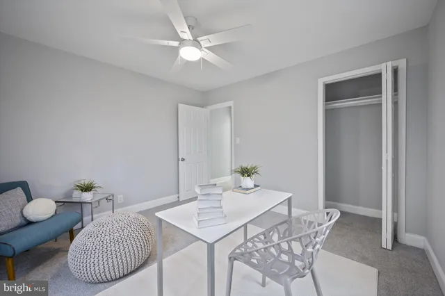 a bathroom with a sink vanity mirror and bathtub