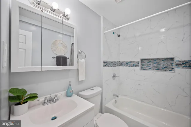 a bathroom with a shower a toilet and a shower