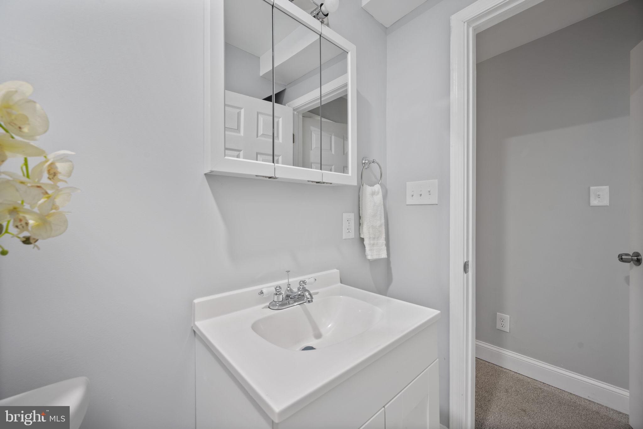 511 Riverside Drive Baltimore, MD 21221 - Photo 17 of 39 a bathroom with a sink and a mirror