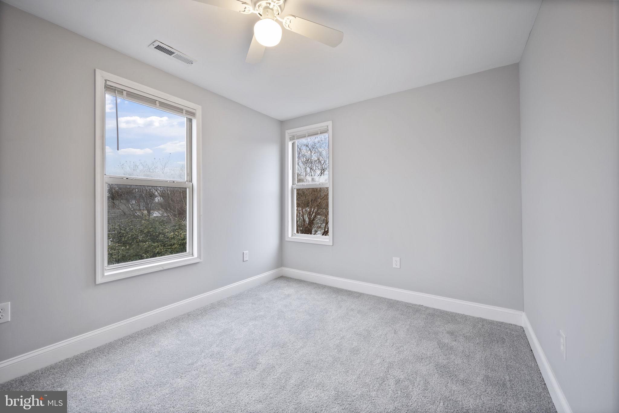 511 Riverside Drive Baltimore, MD 21221 - Photo 25 of 39 an empty room with windows and closet