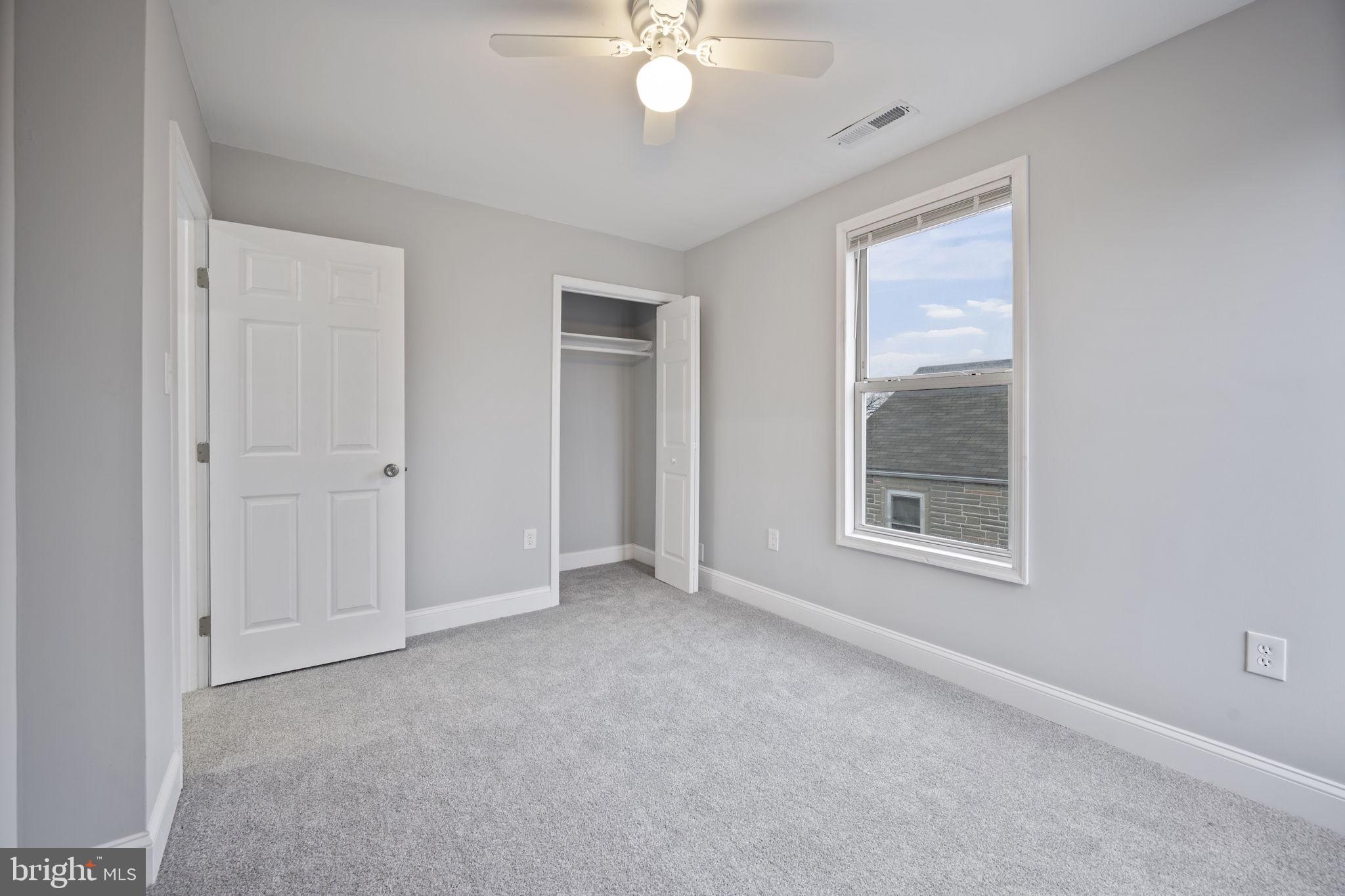 511 Riverside Drive Baltimore, MD 21221 - Photo 26 of 39 an empty room with windows and closet