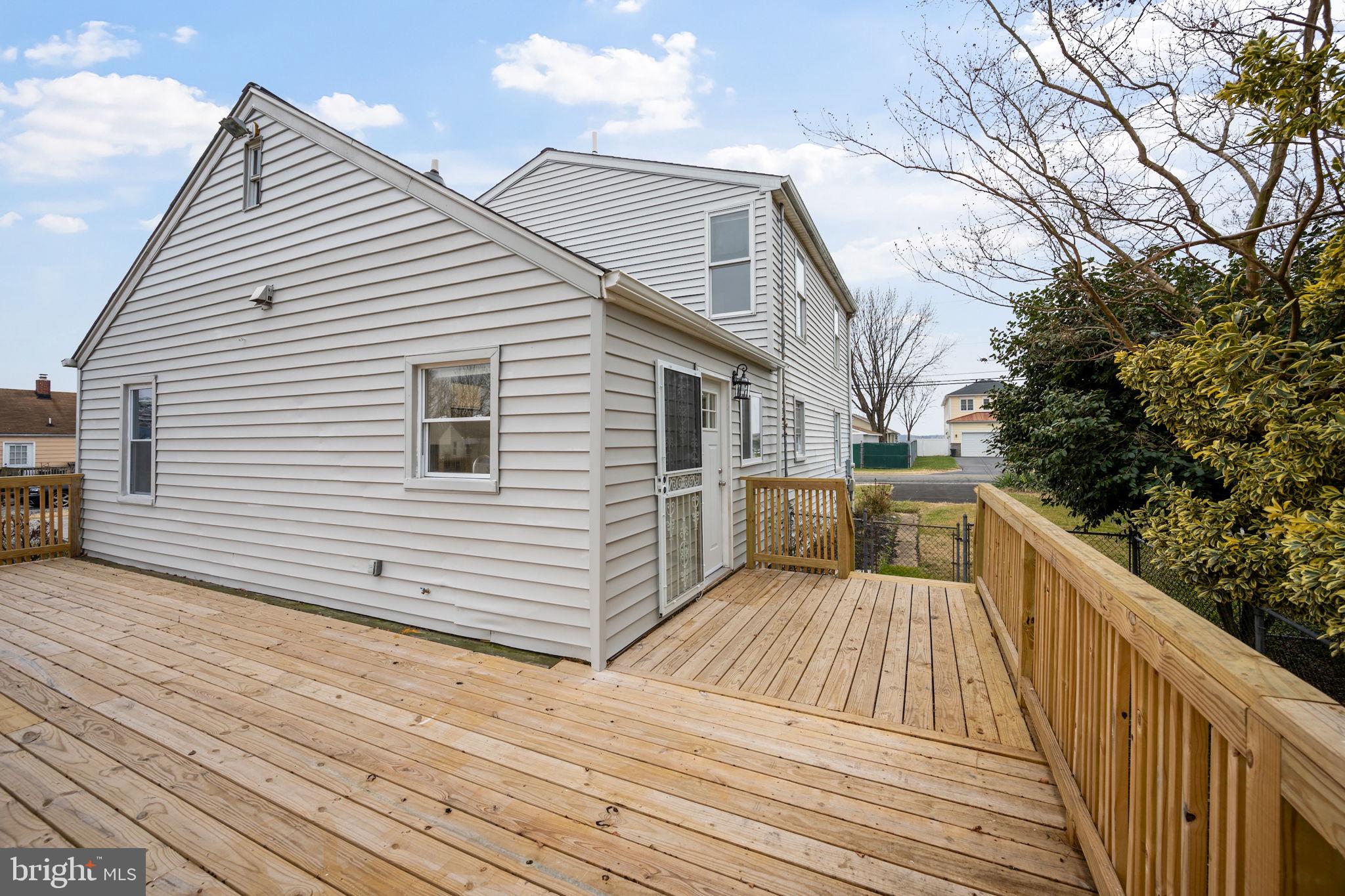 511 Riverside Drive Baltimore, MD 21221 - Photo 29 of 39 a view of a house with backyard and trees