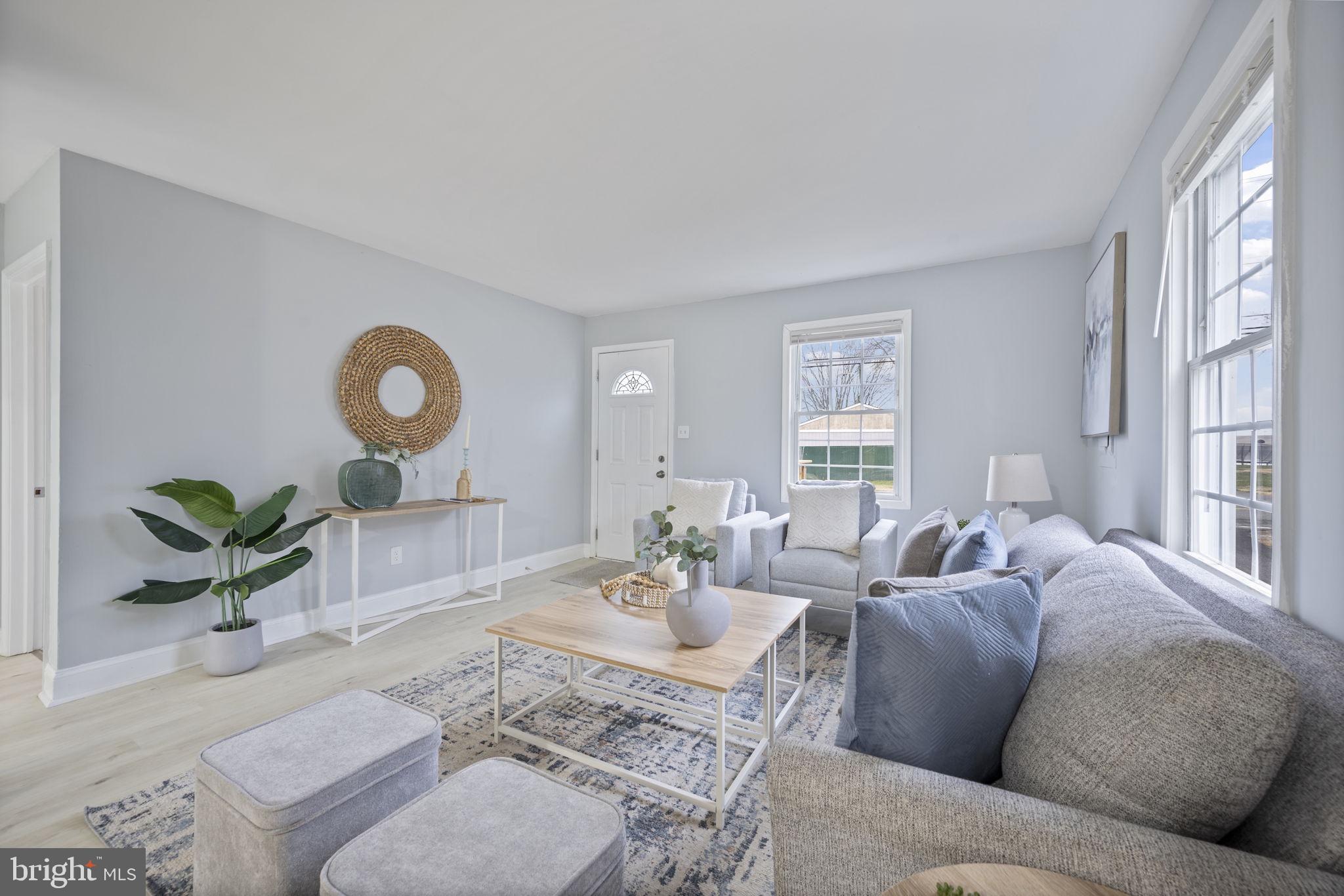 511 Riverside Drive Baltimore, MD 21221 - Photo 3 of 39 a living room with furniture and a large window