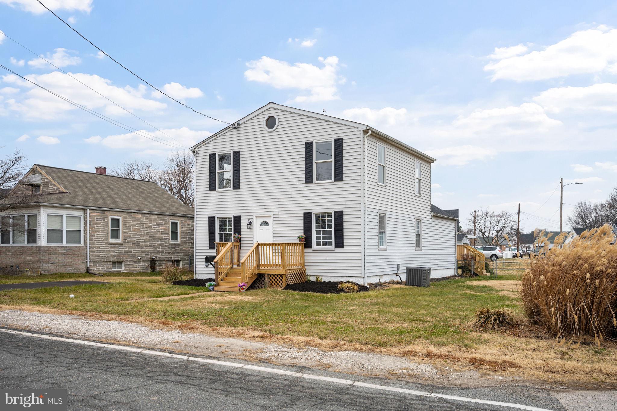 511 Riverside Drive Baltimore, MD 21221 - Photo 38 of 39 a view of a white house with a yard
