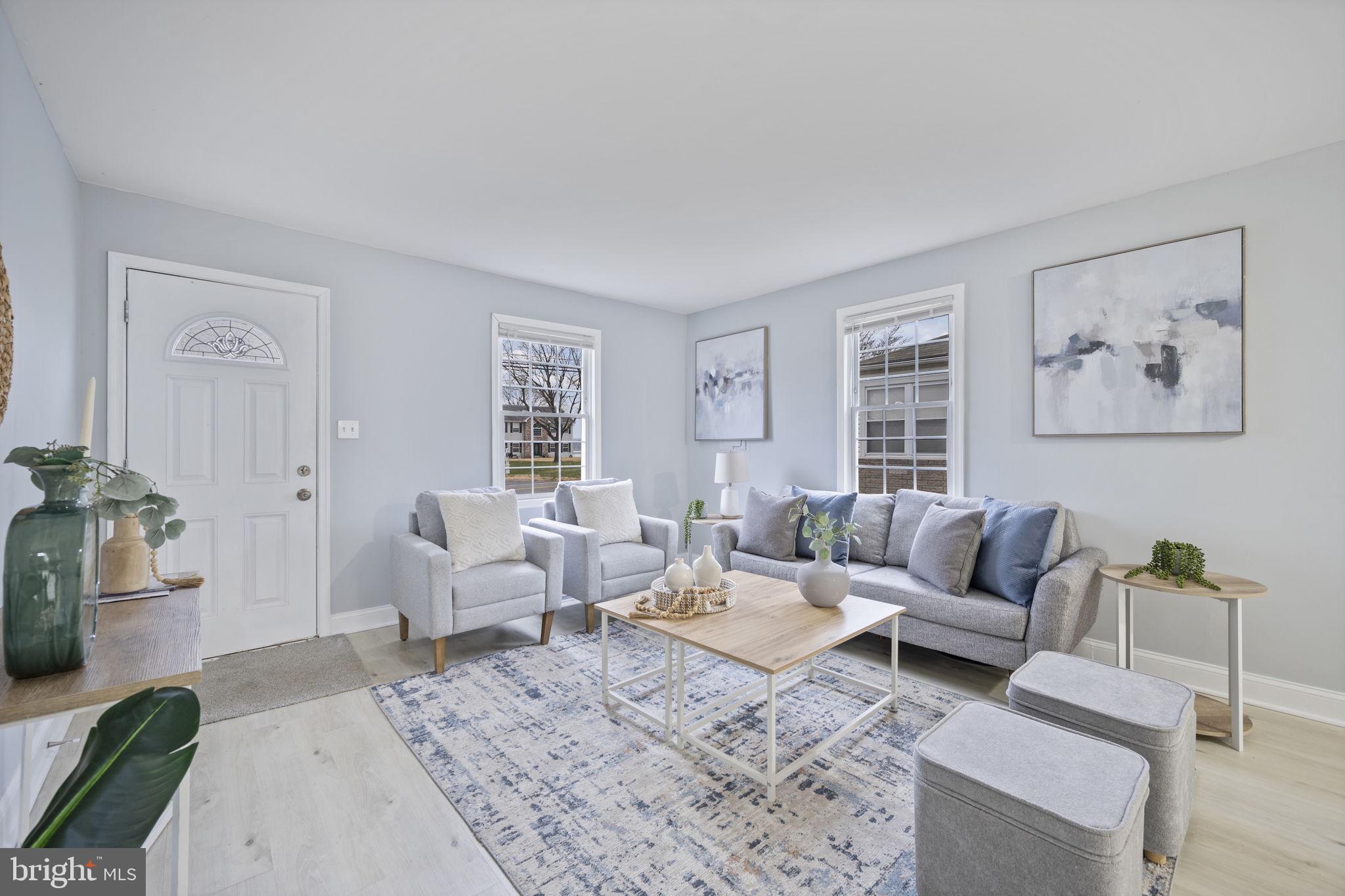 511 Riverside Drive Baltimore, MD 21221 - Photo 4 of 39 a living room with furniture and a large window