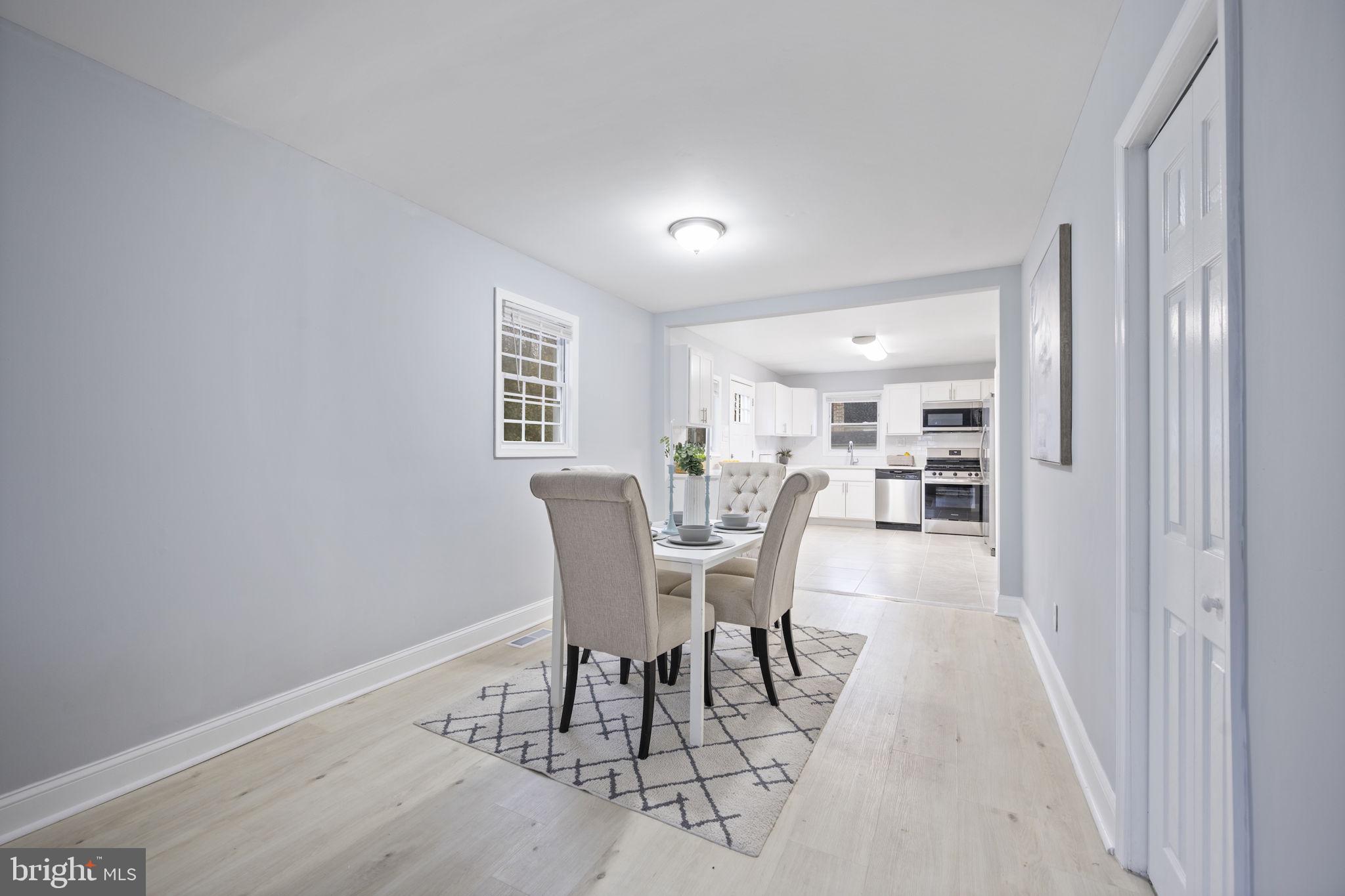 511 Riverside Drive Baltimore, MD 21221 - Photo 6 of 39 a view of a dining room with furniture and a livingroom