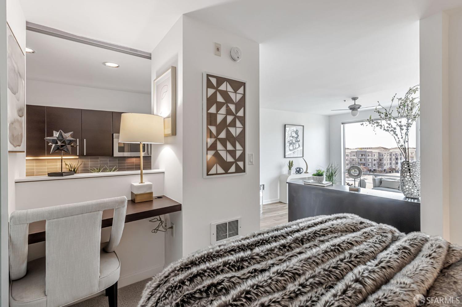 200 2nd Street, Unit 408 Oakland, CA 94607 - Photo 20 of 29 a bedroom with a bed and a window