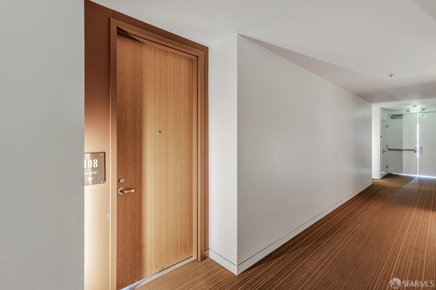 200 2nd Street, Unit 408 Oakland, CA 94607 - Photo 9 of 29 a view of an empty room with wooden floor and a window