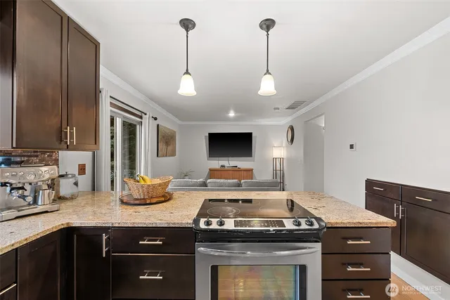 a kitchen with a stove and a sink