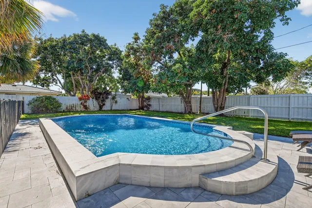 a view of a swimming pool with a patio