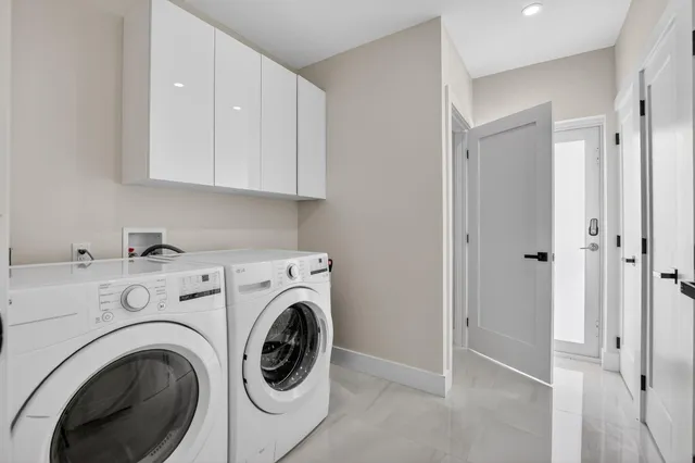 a view of hallway with washer and dryer