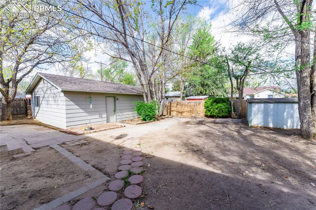 2818 Templeton Gap Road Colorado Springs, CO 80907 - Photo 20 of 27 a front view of a house with a yard and garage