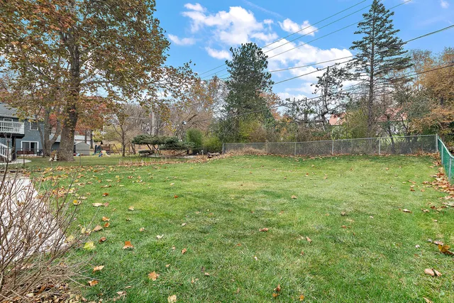 a backyard of a house with lots of green space
