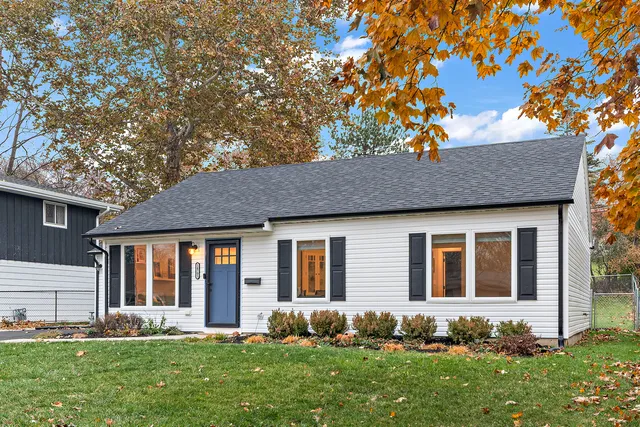 a front view of a house with garden