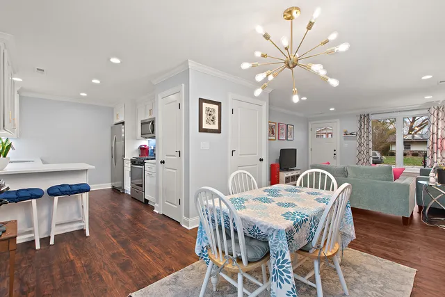 a view of a dining room with furniture and wooden floor