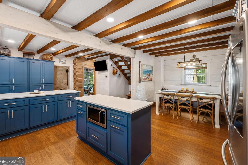 585 John Fleming Road Hartwell, GA 30643 - Photo 14 of 59 a kitchen with wooden cabinets and sink