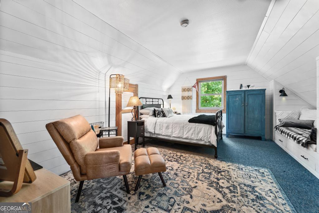 585 John Fleming Road Hartwell, GA 30643 - Photo 23 of 59 a bedroom with furniture and a fireplace