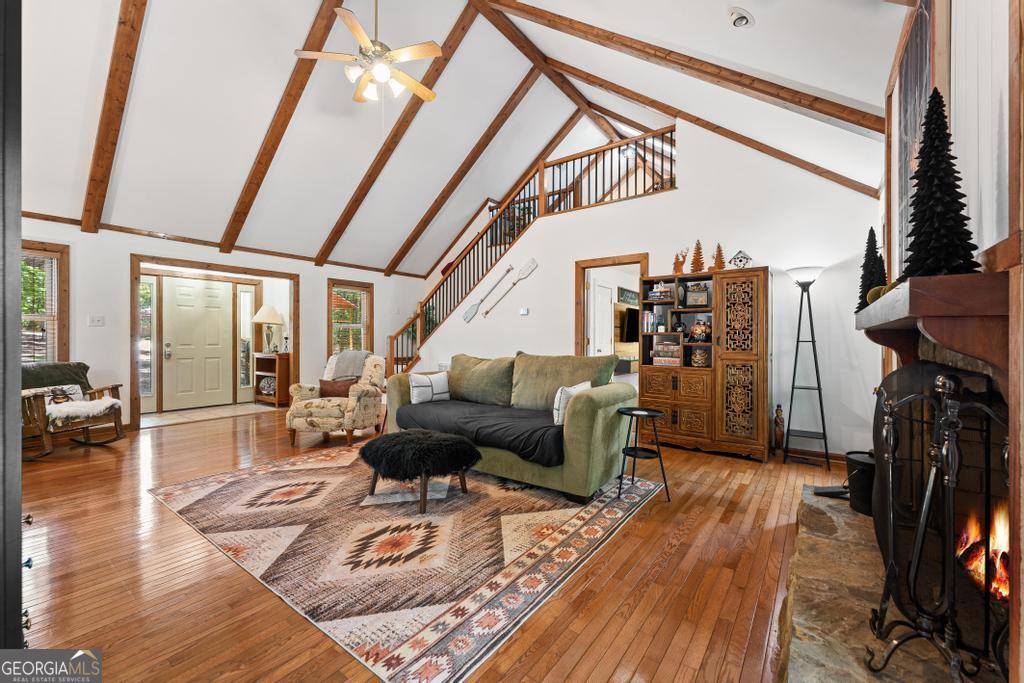 585 John Fleming Road Hartwell, GA 30643 - Photo 28 of 59 a living room with furniture a fireplace and wooden floor