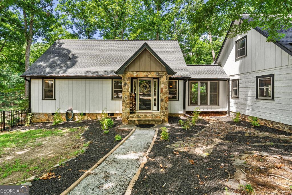 585 John Fleming Road Hartwell, GA 30643 - Photo 5 of 59 a house with trees in the background
