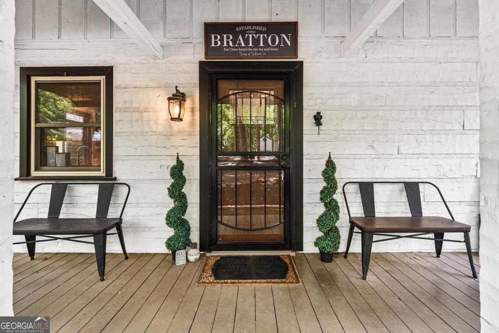 585 John Fleming Road Hartwell, GA 30643 - Photo 8 of 59 a view of a chairs and a table in a balcony