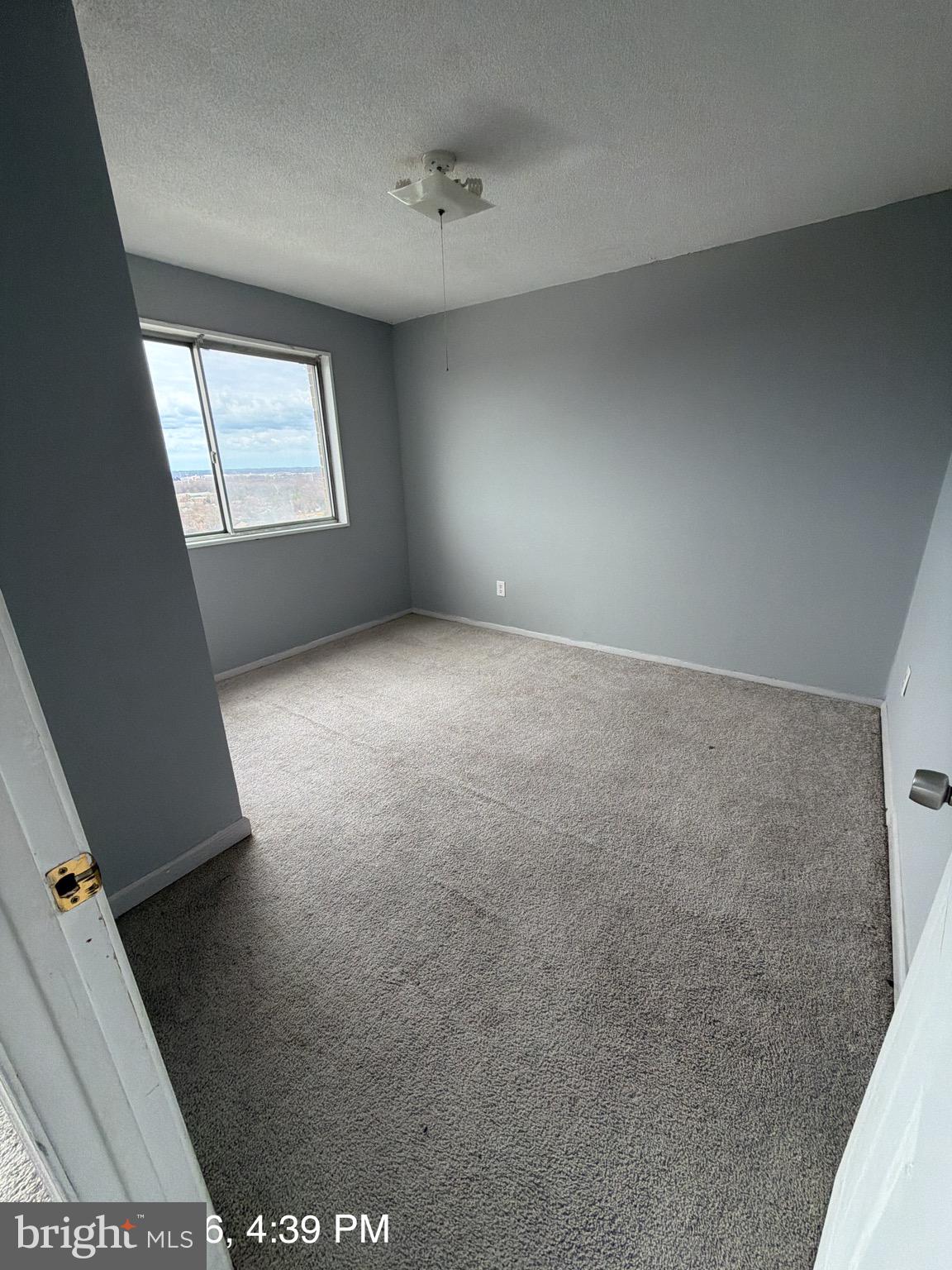 1836 Metzerott Road, Unit 1903 Hyattsville, MD 20783 - Photo 4 of 4 an empty room with windows