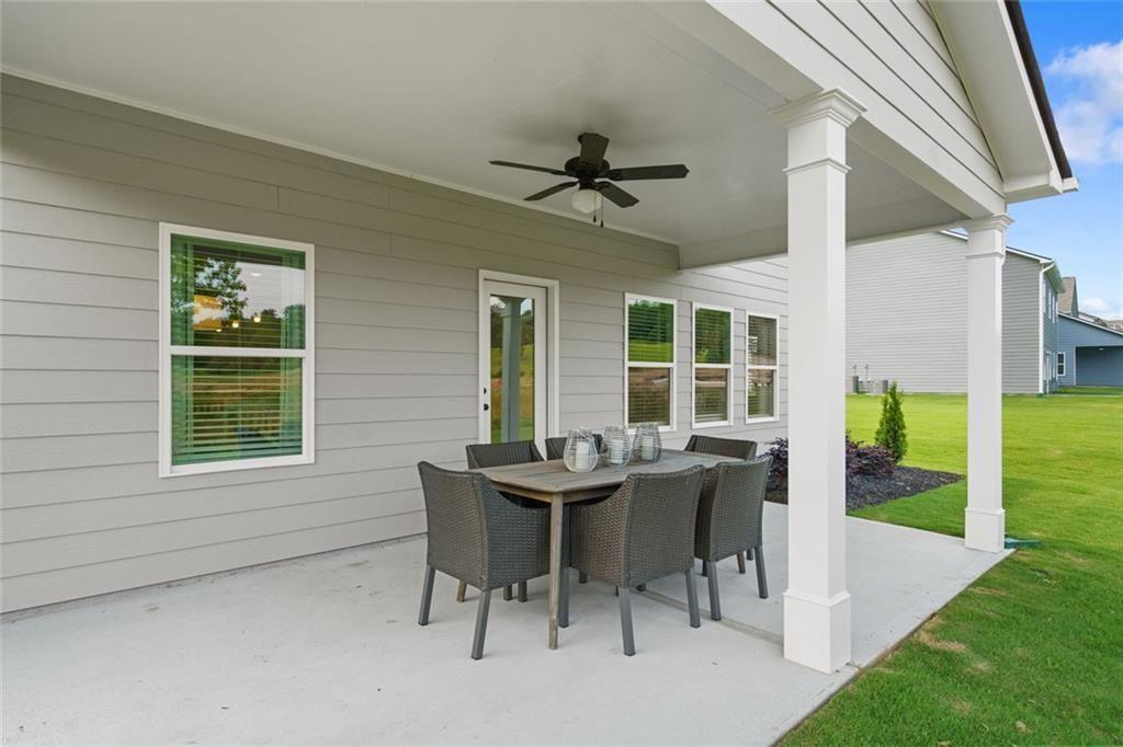 106 Shire Loop Calhoun, GA 30701 - Photo 45 of 45 a view of a dining room with a table and chairs