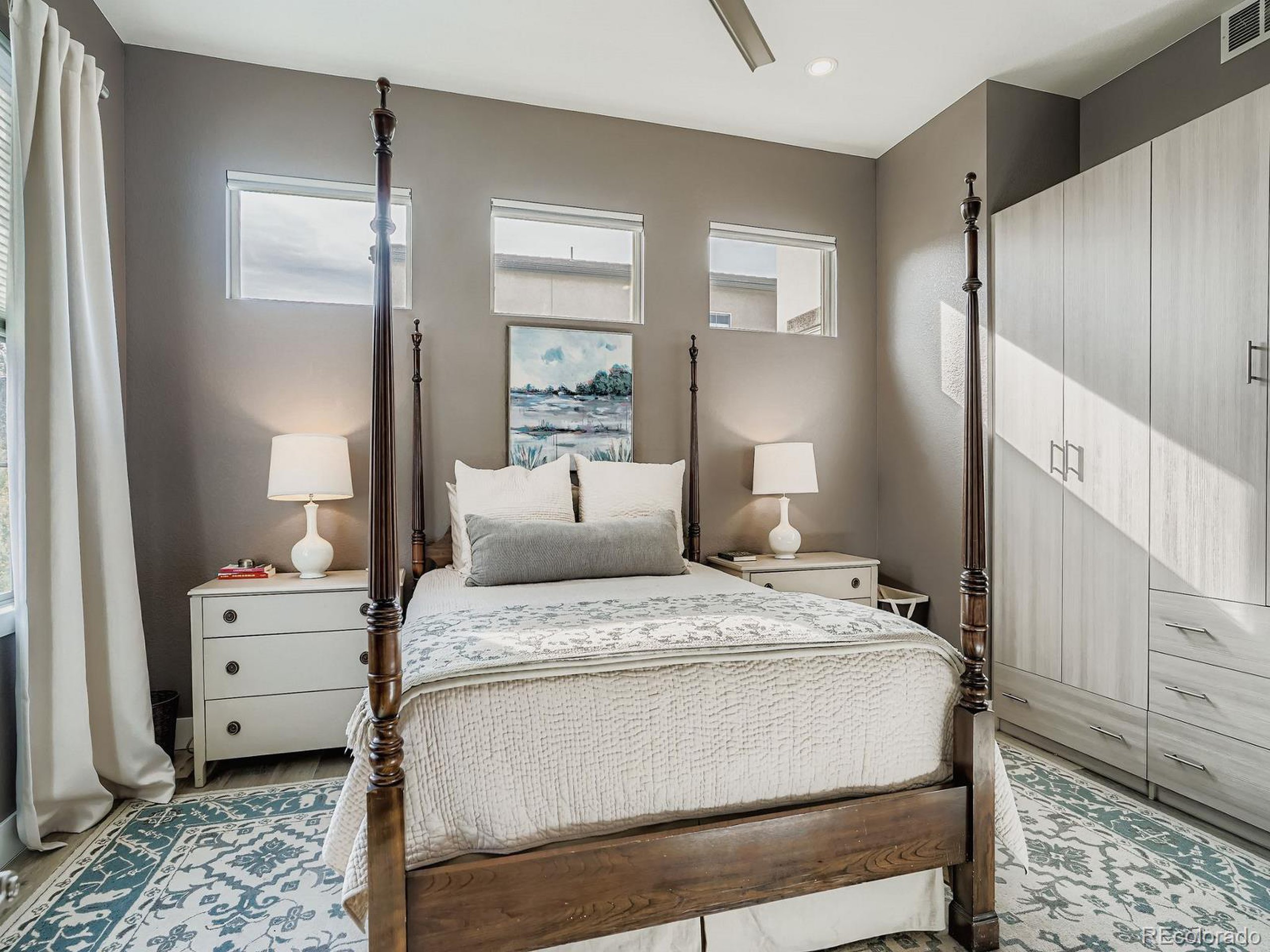 15506 W Lane Lakewood, CO 80228 - Photo 12 of 37 a room with a bed and a window