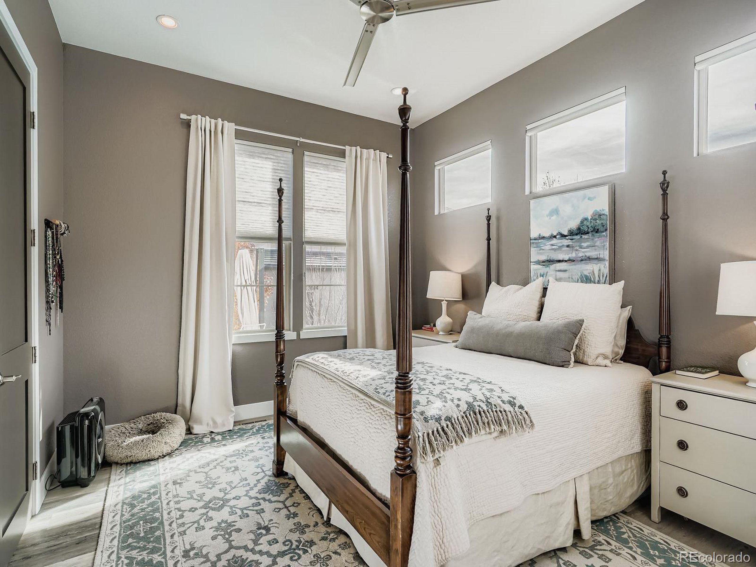 15506 W Lane Lakewood, CO 80228 - Photo 13 of 37 a bedroom with a bed and wooden floor