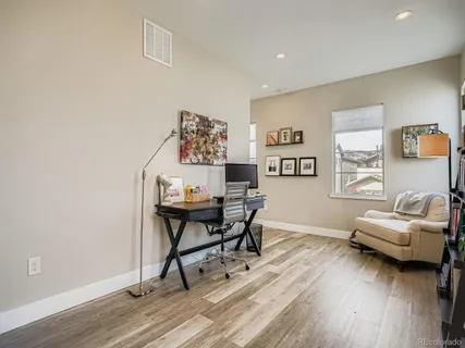 a workspace with furniture and wooden floor
