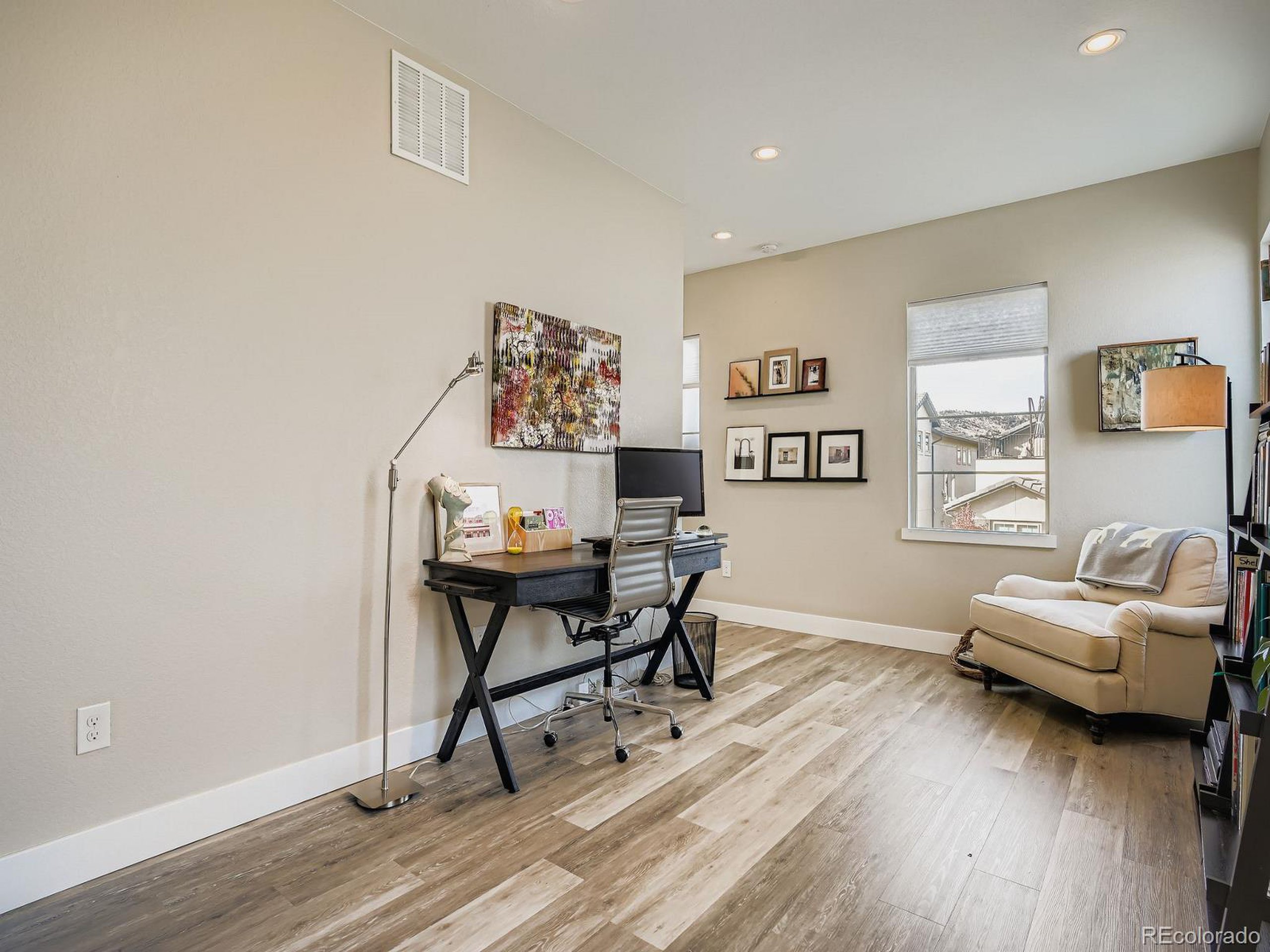 15506 W Lane Lakewood, CO 80228 - Photo 18 of 37 a workspace with furniture and wooden floor
