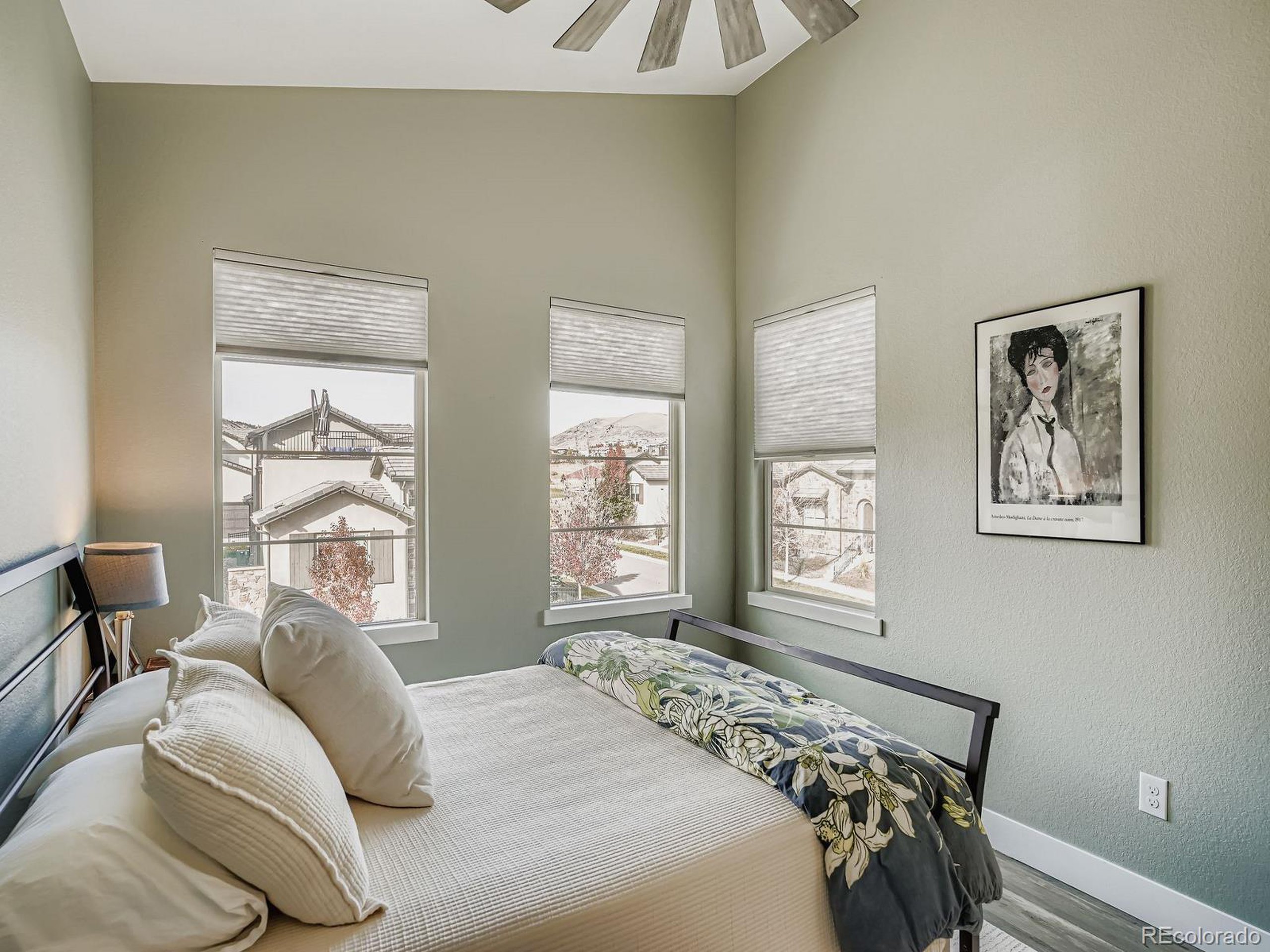 15506 W Lane Lakewood, CO 80228 - Photo 21 of 37 a bedroom with a bed and a window