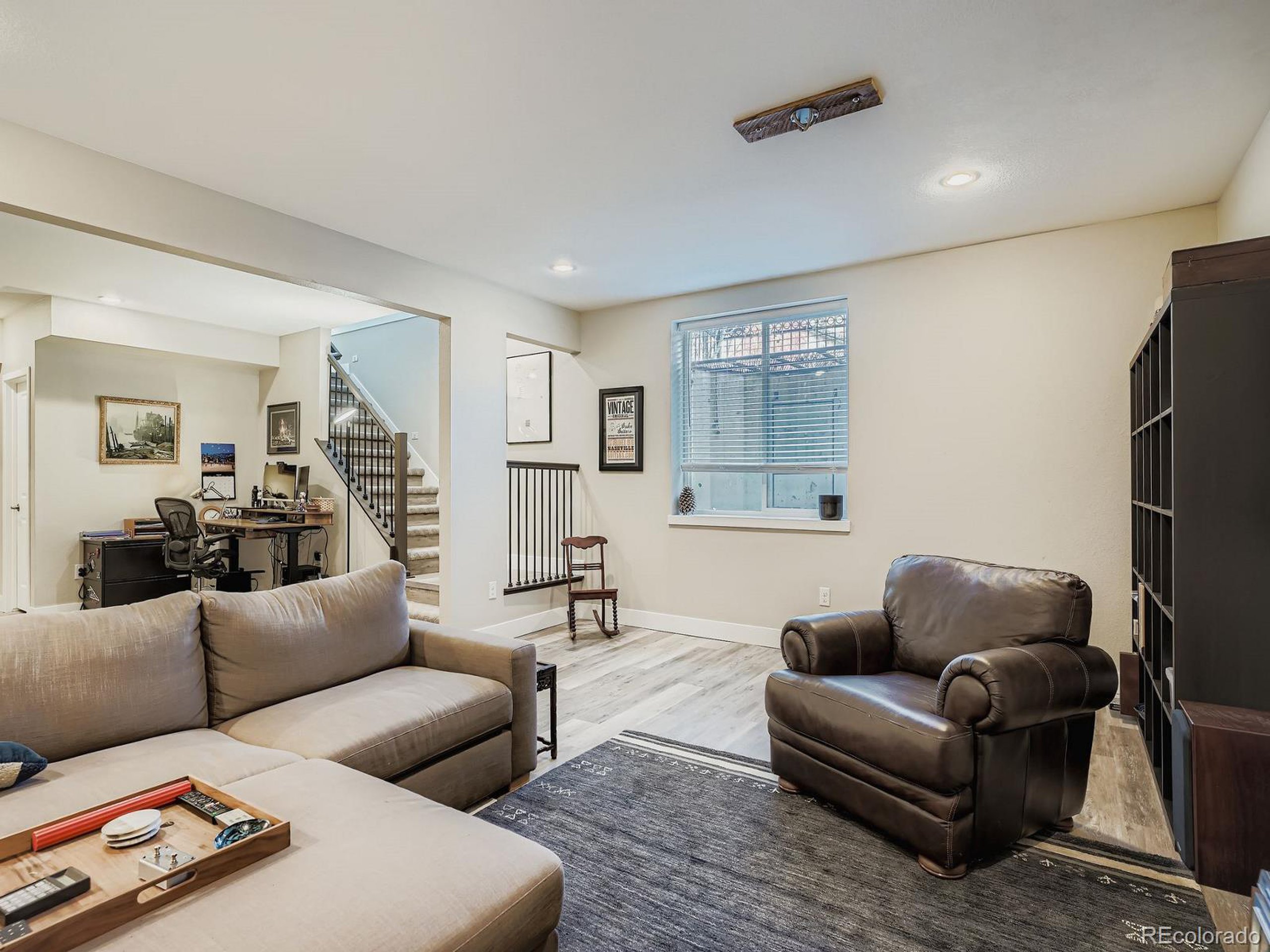 15506 W Lane Lakewood, CO 80228 - Photo 26 of 37 a living room with furniture window and a table