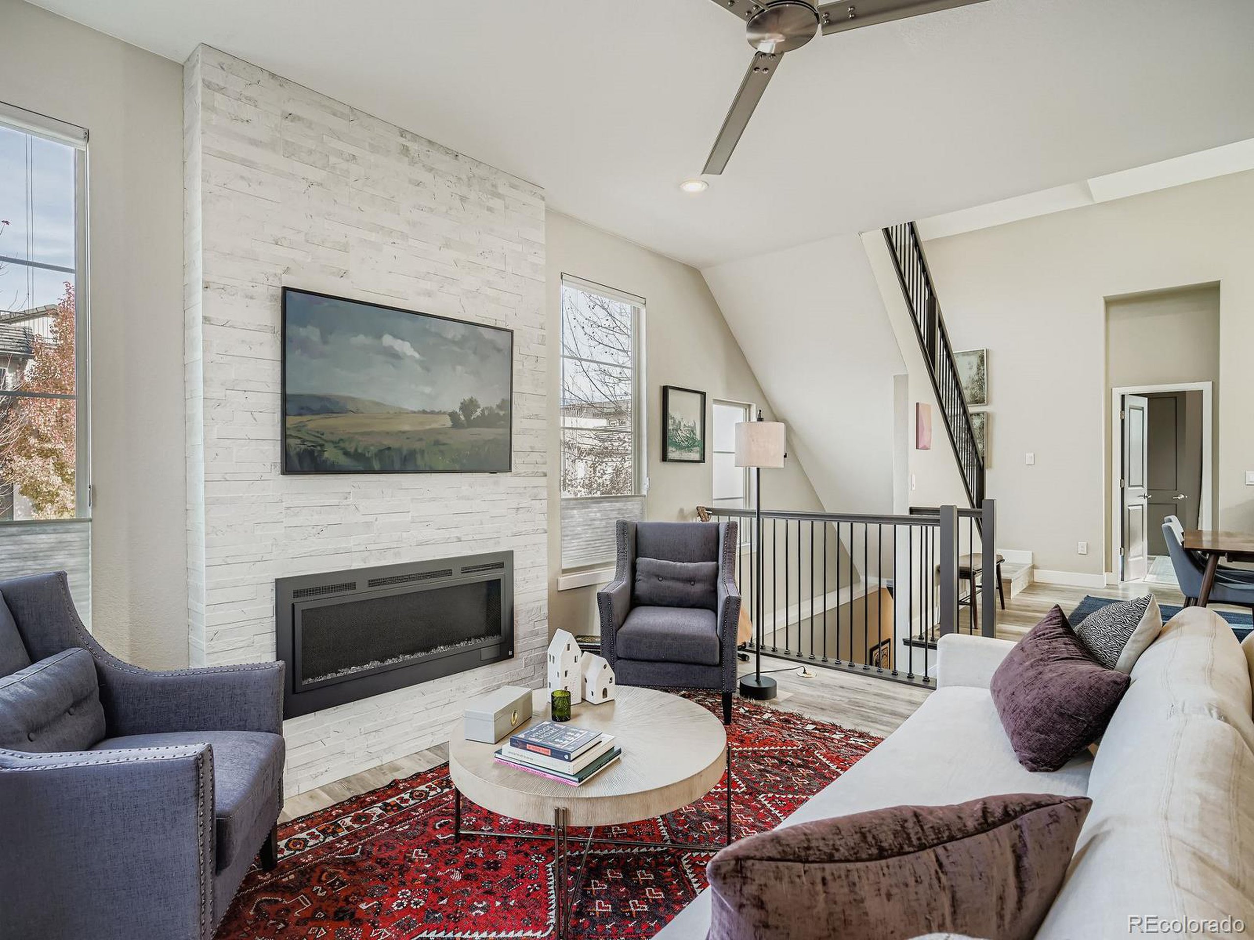 15506 W Lane Lakewood, CO 80228 - Photo 3 of 37 a living room with furniture fireplace and a flat screen tv