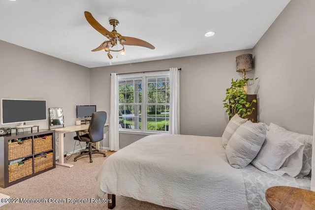 a bedroom with a bed and a table