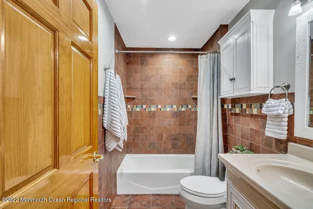 a view of a room with a chair and tables