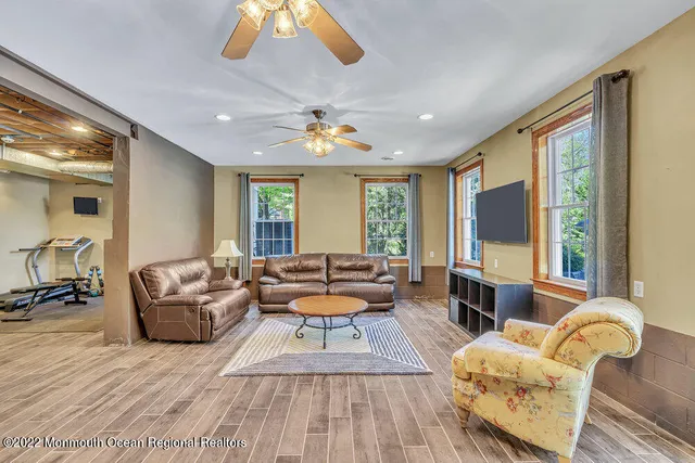 a view of a patio with table and chairs and wooden floor