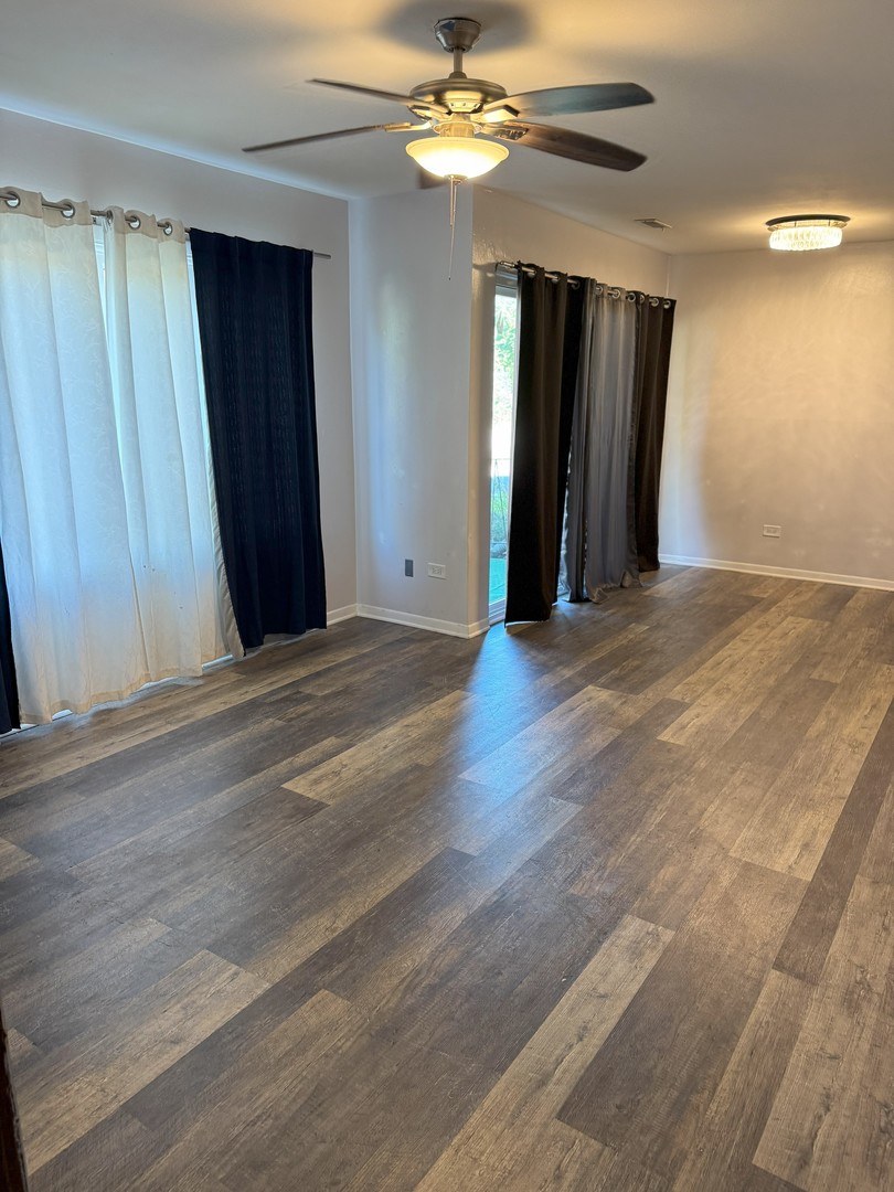 6027 103rd Street, Unit 1A Chicago Ridge, IL 60415 - Photo 2 of 7 a view of an empty room with closet and a window
