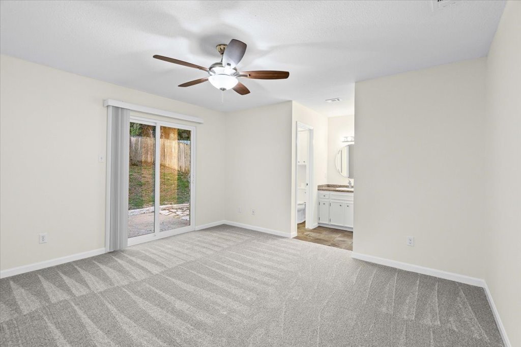 361 Fantail Loop, Unit B Austin, TX 78734 - Photo 16 of 29 a view of empty room with window and ceiling fan