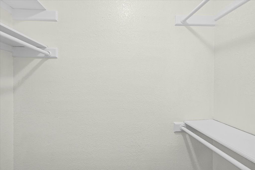 361 Fantail Loop, Unit B Austin, TX 78734 - Photo 19 of 29 a view of a room with racks on the wall