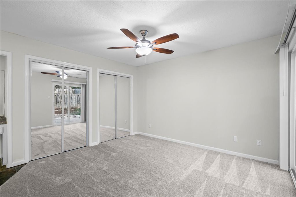 361 Fantail Loop, Unit B Austin, TX 78734 - Photo 20 of 29 an empty room with closet and windows