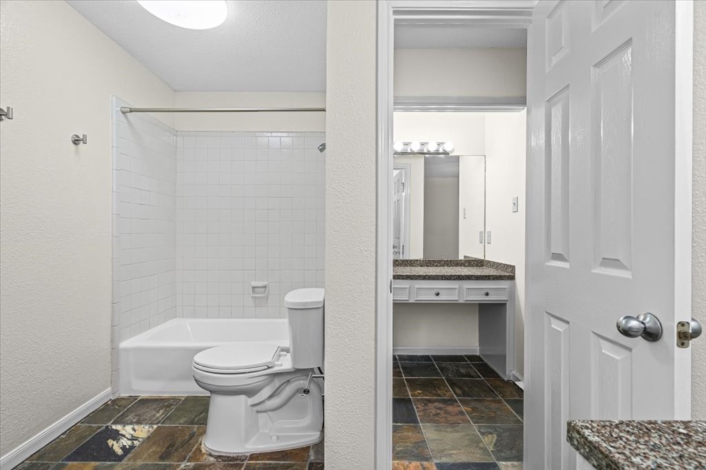 361 Fantail Loop, Unit B Austin, TX 78734 - Photo 23 of 29 a bathroom with a toilet and a shower